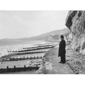 British Police Officer Standing at Foot of Dover Cliffs, Path for 