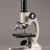 Compound light microscope for use with viewing biological specimens on 