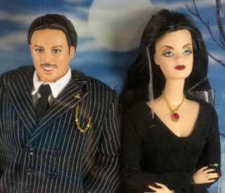 The Morticia Barbie doll comes with a low cut, form fitting black 